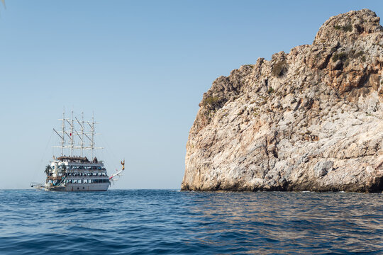 Tourist Cruise Ship Sailing Near Famous Rocky Cliff in Alanya Turkey