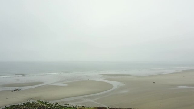 The dunes of the Slack and the sea on a foggy day. France, Nord Pas de Calais.
