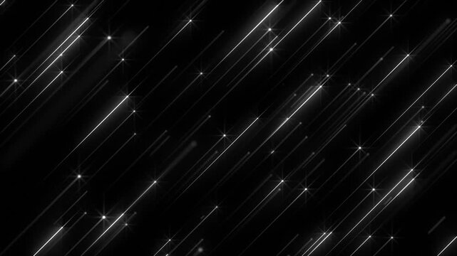 Bright shiny shooting stars moving across the night sky. This glittering starry night motion background is full HD and a seamless loop.