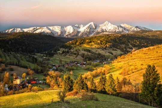 Scenic Landscape view with golden rays in Zamagurie, Tatras background, Slovakia