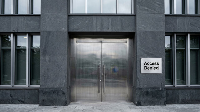 Modern institutional entrance with restricted access sign symbolizing governmental control administrative regulation and political limitation