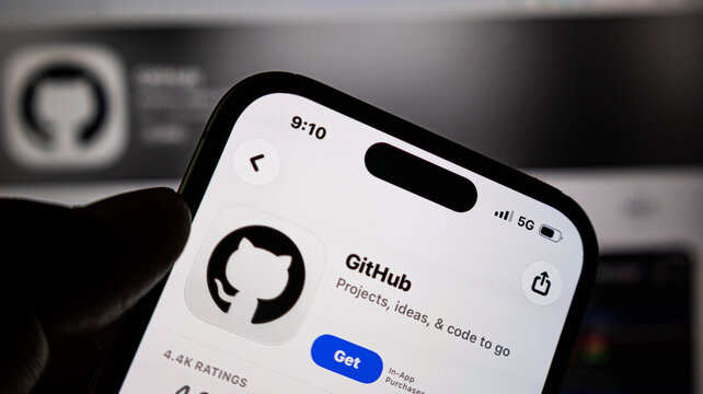 Closeup of a smartphone screen displaying the github mobile application page in the apple app store