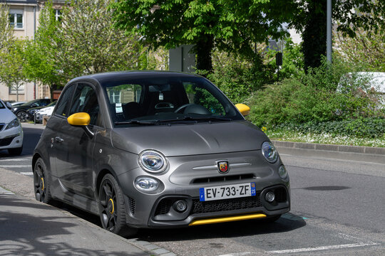 Nancy, France - April 18th 2026 : View on a grey Abarth 595 Pista with yellow details parked on a street. The Abarth 595 is a sports car based on the Fiat 500, transformed into a sportier version.