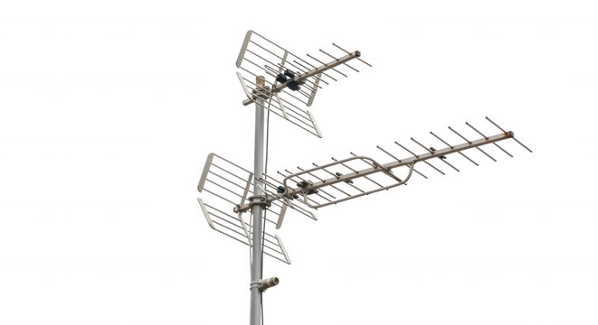 Silver metal television antenna array mounted on a vertical pole against a solid black background, showing multiple directional reception grids