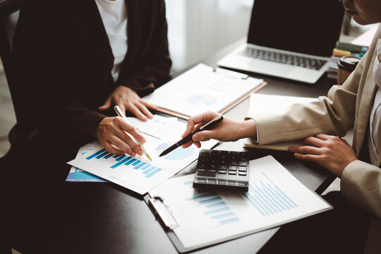Business team analyzing financial data and market statistics, collaborating on project planning, discussing investment strategies, and reviewing growth reports in an office meeting