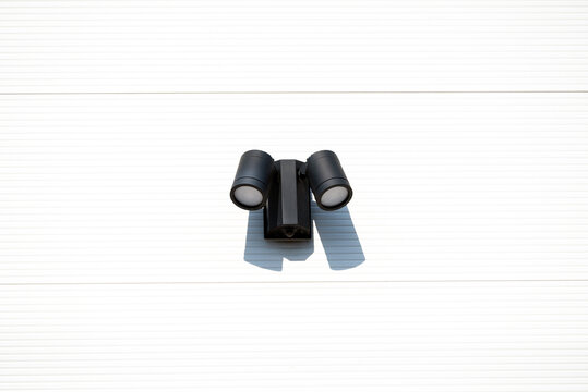 Outdoor LED Security Spotlight with Motion Sensor Mounted on Exterior Wall