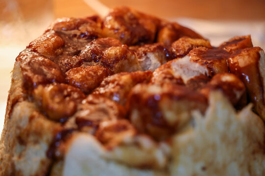 Delicious, gooey monkey bread fresh baked for a tasty breakfast. The sticky food is similar to a hot cinnamon roll or bun. 