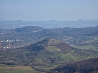 Fototapeta premium Germany, panoramic Limburg hill landscape with Swabian Alb mountains and Weilheim village on clear winter day
