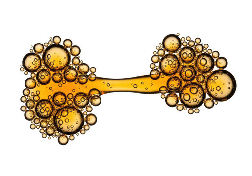 Amber oil bubbles in dumbbell shape isolated on a transparent background