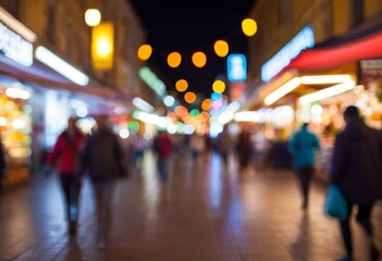 Fototapeta premium Blurred background of a bustling street with lights reflecting on the wet ground at night