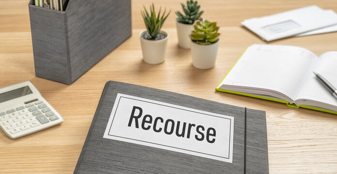 A folder on a desk with the label Recourse