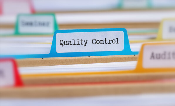 File folders with a tab labeled Quality Control