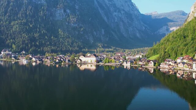 Drone View of Picturesque Lakeside Town Hallstatt with Layered Alp Mountains towering above. Warm Summer Morning. Salzkammergut, Austria UNESCO heritage site