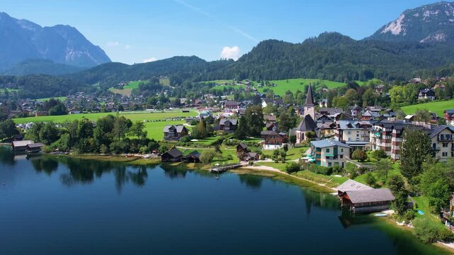 Experience breathtaking aerial views of Altausseer Lake in Austria Salzkammergut showcasing its clear waters, lush landscapes, and majestic mountains. Nature beauty in one spectacular shot.