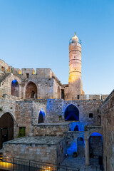 Fototapeta premium The Tower of David in the Old City of Jerusalem with evening illumination and lit by the rays of the setting sun.Israel.
