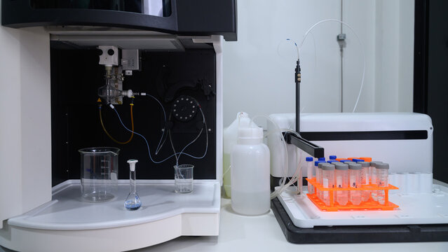 Automated Laboratory Analyzer with Sample Tubes and Glassware in Modern Clinical Lab