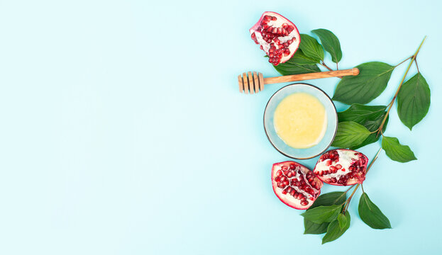 Rosh hashanah, jews celebrate new year of jewish calendar, pomegranate with honey, food for holiday tradition