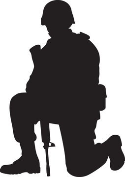 Silhouette of a soldier kneeling with a rifle