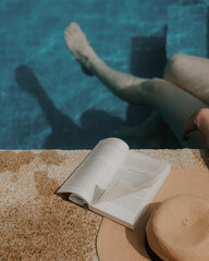 woman reading a book in the pool