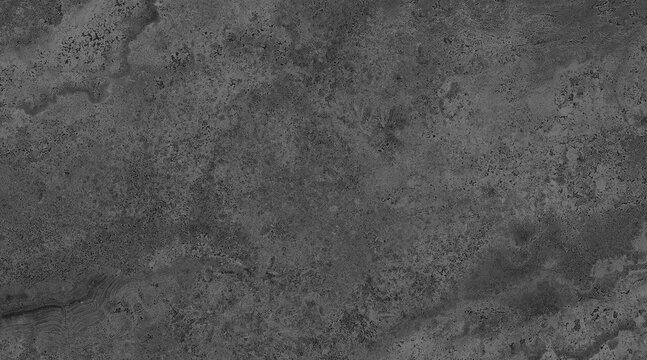 A close-up, textured surface of weathered gray stone, showcasing its rough, uneven topography. The image captures the intricate details and natural imperfections of the rock formation