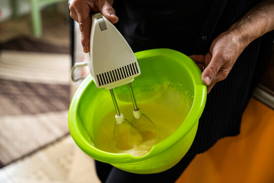 The hostess prepares the cakes heart waffle,old-fashioned way, using traditional European cuisine and utensils.