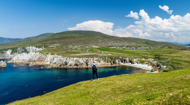 Misty White Cliffs of Ashleam on Achill Island, County Mayo, Ireland. Dramatic Atlantic sea cliffs and turquoise water on the Wild Atlantic Way.