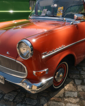 Berlin, Germany - May 2, 2026: Detail of orange Opel Rekord at car show