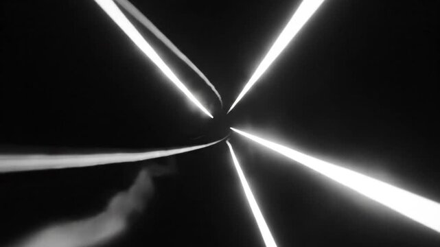 Abstract starburst light beams emanating from a dark central point creating an immersive perspective