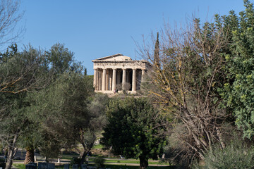 Fototapeta premium Temple of Hephaestus in Athens Greece Ancient Agora ruins and trees on a clear day