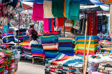 Obraz premium Otavalo Market Ponchos Plaza with Colorful Indigenous Textiles and Crafts, Ecuador