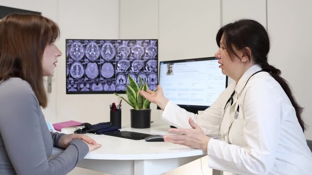 Doctor admits uncertainty during medical consultation while young woman waits for answers about complex health problem and unclear brain scan results