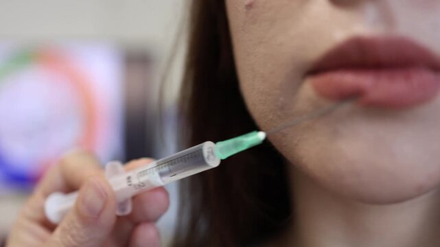 Young woman questions modern beauty ideals during cosmetic lip filler procedure while aesthetic medicine and social pressure influence appearance and self confidence