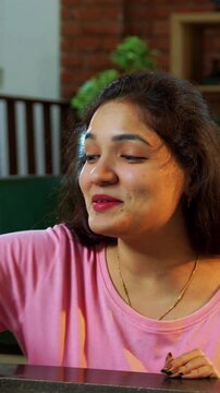 Family playing carrom board game together at home, enjoying bonding time with young children