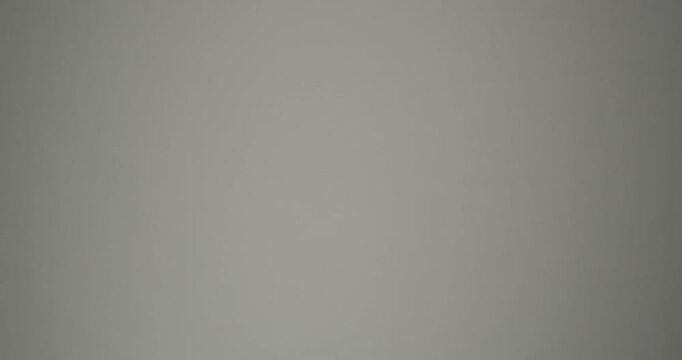 Tiny water waves sparkle in gentle light. Minimal waves move slowly across a smooth surface. Can be used as overlay elements for design projects. Video in loop.