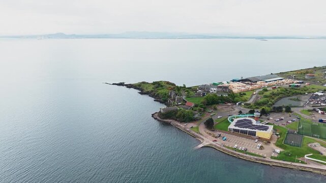 Drone forward flyover of Lammerlaws headland and scenic Burntisland coastline, Fife, Scotland