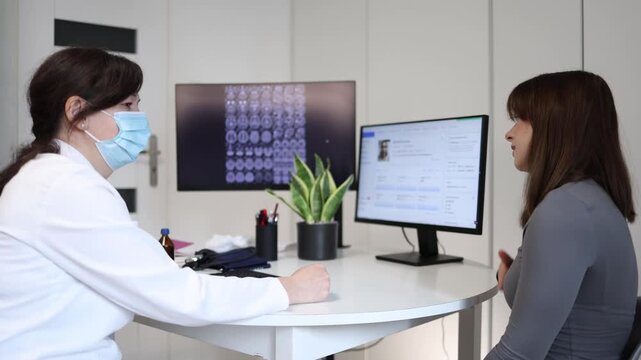 Doctor scolding young woman during medical consultation because of irresponsible attitude toward treatment stressed patient listening to serious healthcare warning in clinic