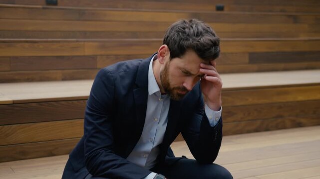 Sad man Caucasian businessman thinking problem upset worker outdoors city fail depressed male business employer health trouble headache worried guy think alone work loss career crisis tired exhausted