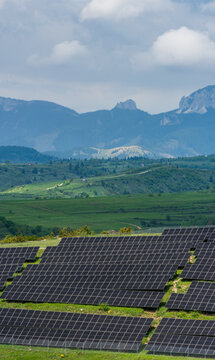 Romania Solar Farm with Piatra Singuratică Nature Reserve Mountain View.