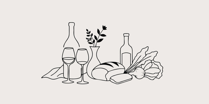 Romantic dinner setting with wine bottles glasses flowers and bread