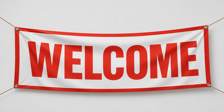 Welcome red and white vinyl banner hanging with ropes on light background.