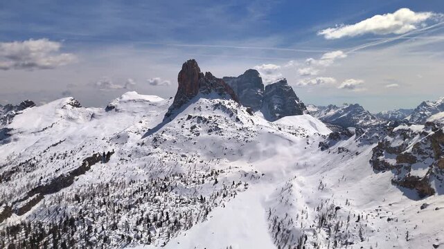 Wide aerial panorama of snow-blanketed Ampezzo Dolomites with jagged peaks ok Becco del Mezzod&Atilde;&not; and Pelmo, Cortina, Italy