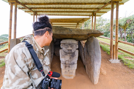 Traveler photographing religious tomb at San Agustin Park