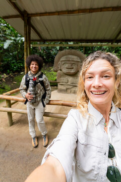 Travelers selfie at San Agustin Archaeological Park monument