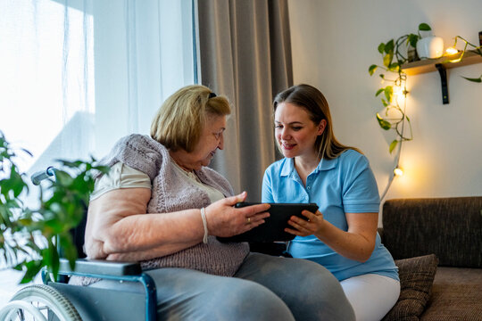 Diabetologist nurse testing blood sample on blood sugar meter.