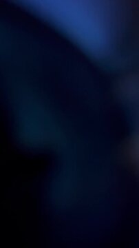 Dark blue abstract background with smooth soft light motion overlay