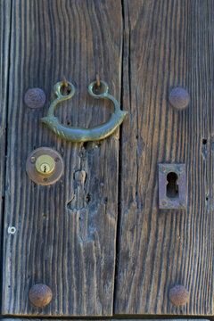 Old wooden door brass handle
