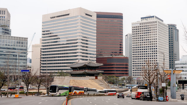 Urban roundabout framing a traditional pagoda in Seoul