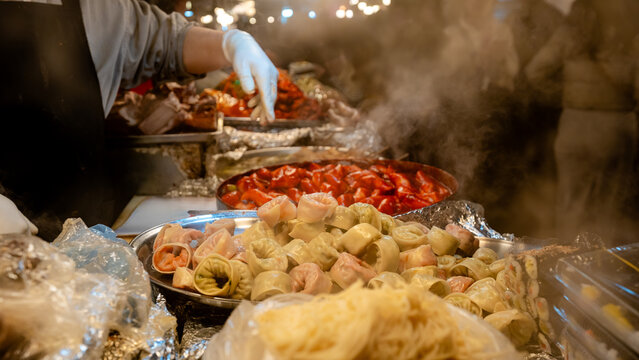 Steaming mandu dumplings at Gwangjang Market food stall