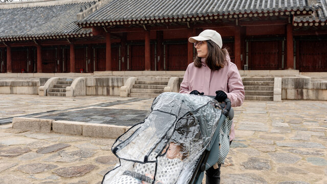 Travel family visiting Jongmyo Shrine courtyard in Seoul