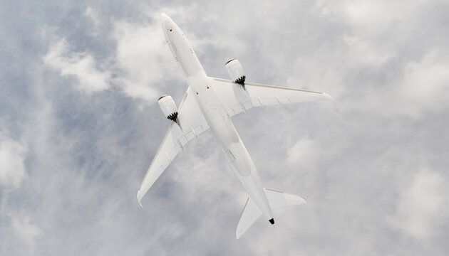 Passenger airplane flying above clouds in overcast sky